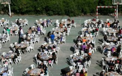 People have breakfast at school hosting displaced Lebanese in the southern city of Sidon