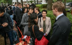 Diplomats queue outside the West Kowloon Magistrates' Court in Hong Kong 