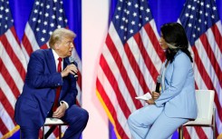 Former US congresswoman Tulsi Gabbard -- pictured with Donald Trump in Wisconsin during the election campaign -- is another of the president-elect's controversial nominees