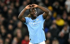 Jeremy Doku celebrates scoring Manchester City's third goal against Nottingham Forest