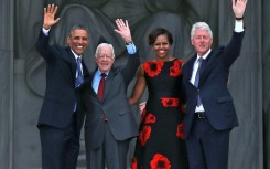 Former presidents including Barack Obama and Bill Clinton, pictured here with Jimmy Carter in 2013, paid tribute to the one-time peanut farmer and Nobel laureate