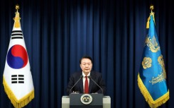 This handout from the South Korean Presidential Office taken on December 3, 2024 shows South Korean President Yoon Suk Yeol delivering a speech to declare martial law in Seoul