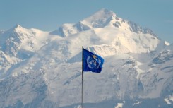 The WMO flag flies on top of its headquarters in Geneva, in front of the Mont Blanc massif