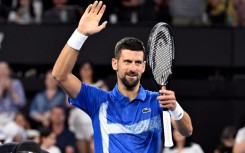 Novak Djokovic celebrates defeating Gael Monfils in Brisbane