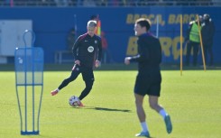 Barcelona midfielder Dani Olmo (L) is in an uncertain situation with the club not yet registering him