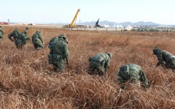 Soldiers have scoured the site of the Jeju Air passenger plane crash