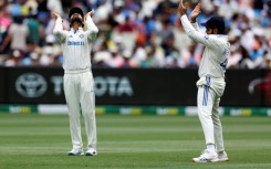 India's Virat Kohli (L) and Rohit Sharma during the fourth Test in Melbourne