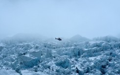 A helicopter flies over Mount Everest on May 2, 2021