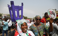 The jubilant crowd wore the green, red, black and white of Mahama's National Democratic Congress