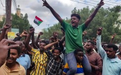 People in Sudan's de facto capital Port Sudan, which hosts the army-aligned government, take to the streets to celebrate the reported advance of Sudanese military forces and allied armed groups on the key Al-Jazira state capital, Wad Madani
