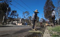 Some locals are not waiting for the official clean up and have started fixing the streets themselves