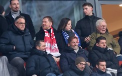 Jurgen Klopp (2ndR C) sits next to former Germany forward Mario Gomez (R) in RB Leipzig's 4-2 win over Werder Bremen