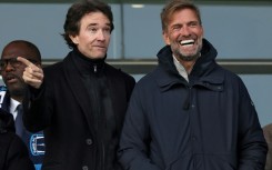 German football coach Jurgen Klopp (R) and Antoine Arnault (L) whose family have purchased a stake in French Ligue 2 club Paris FC before a match on Saturday