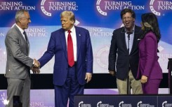 US President-elect Donald Trump (2nd L) has picked some controversial cabinet nominees, including Robert F. Kennedy Jr (L) and former US congresswoman Tulsi Gabbard (R)