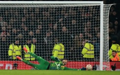 Man of the moment: Manchester United goalkeeper Altay Bayindir saves the penalty of Kai Havertz in the shootout