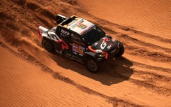 South African driver Henk Lategan and South African co-driver Breet Cummings compete during Stage 8 of the Dakar Rally