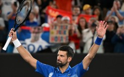 Novak Djokovic celebrates after victory against Portugal's Jaime Faria 