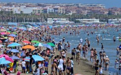 People crowd the beach in Valencia on July 5, 2024