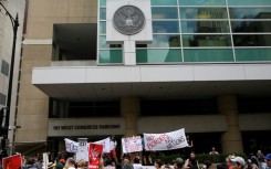 People protest against US Immigration and Customs Enforcement and the first Trump administration's immigration policies outside a Chicago ICE office in 2018