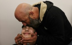 Crowds cheer as freed Palestinian prisoners arrive in West Bank town