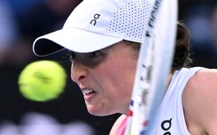 Focused: Iga Swiatek hits a return against Eva Lys