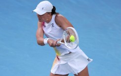 Poland's Iga Swiatek hits a return against Germany's Eva Lys 