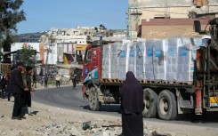 A truck carrying much needed humanitarian aid drives through southern Gaza's Rafah
