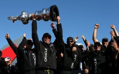 Oracle CEO Larry Ellison and Oracle Team USA celebrates onstage in San Francisco after the America's Cup in 2013