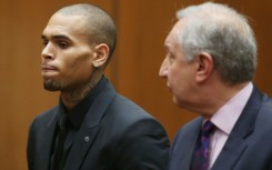 Chris Brown, pictured in court in 2013, has filed a $500 million lawsuit against Warner Bros and others for making a 'defamatory documentary'