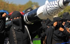 A Yemeni protester holds a mock rocket during an anti-Israel demonstration in the Huthi-controlled capital of Sanaa on January 22, 2025
