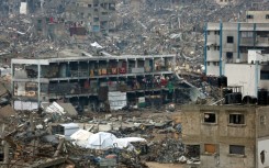 People camp in a heavily damaged UN school surrounded by destruction, as displaced Palestinians return to northern areas of the Gaza Strip
