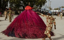 A swirling Zangbeto performs at the Voodoo Festival in Ouidah on January 10, 2025