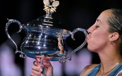 Madison Keys poses with the Daphne Akhurst Memorial Cup after her victory over Aryna Sabalenka