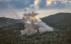 Smoke rises from the site of controlled explosions during demolition activities by the Israeli army in the southern Lebanese village of Kfar Kila