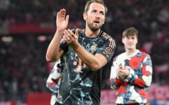 On target: Harry Kane celebrates after Bayern's win over Freiburg on Saturday