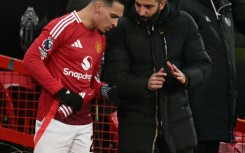 Manchester United's coach Ruben Amorim (R) pictured talking to Antony, who has joined Real Betis on loan