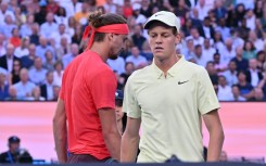 Italy's Jannik Sinner and Germany's Alexander Zverev walk between games during their men's singles final 
