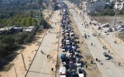 Aerial footage of displaced Palestinians driving back to northern Gaza via Salaheddin road