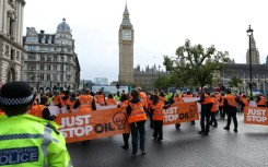 A Just Stop Oil slow march to disrupt traffic in Parliament Square in London in October 2023