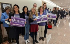 Chana Walker (3rd L) poses with members of "Moms for America" at the US Senate on Capitol Hill in Washington, DC, on January 30, 2025