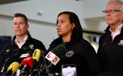 Officials including US Secretary of Transportation Sean Duffy (L) and Washington Mayor Muriel Bowser (C) address a media briefing at Reagan National Airport 