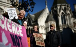 Protesters outside the Royal Courts of Justice in central London to support 16 Just Stop Oil activists