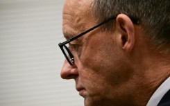 CDU leader Friedrich Merz gets ready to give a statement after German MPs narrowly voted against his party's bill to restrict immigration 