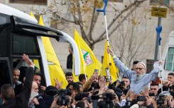 A jubilant crowd greeted a busload of freed Palestinian prisoners in Ramallah on Saturday