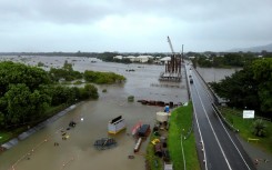 Rising floodwaters swamp areas around Townsville in northeastern Australia