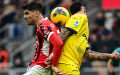 AC Milan's Spanish forward Alvaro Morata (L) in action during a Serie A game against Parma at the San Siro