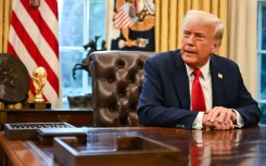 US President Donald Trump speaks to reporters in the Oval Office of the White House