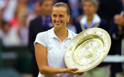 Czech Republic's Petra Kvitova holds the Wimbledon winner's trophy in 2014