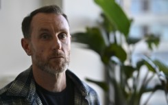 Joseph Lynskey, who survived being pushed onto subway tracks in front of an oncoming train on December 31, 2024, sits during an interview with AFP in New York City