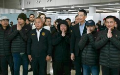 The five freed Thai farm workers arrived Sunday in Bangkok